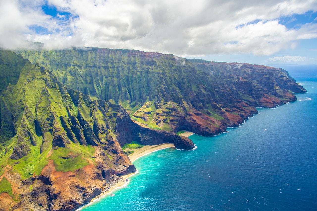 Aerial view of the mountains and coast of Oahu