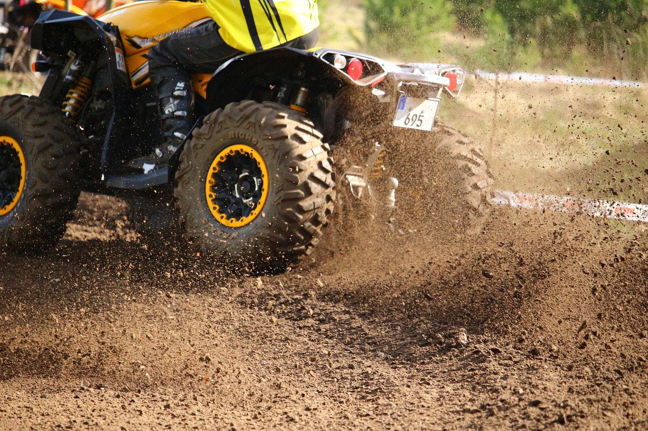 An ATV kicking up mud in Hawaii