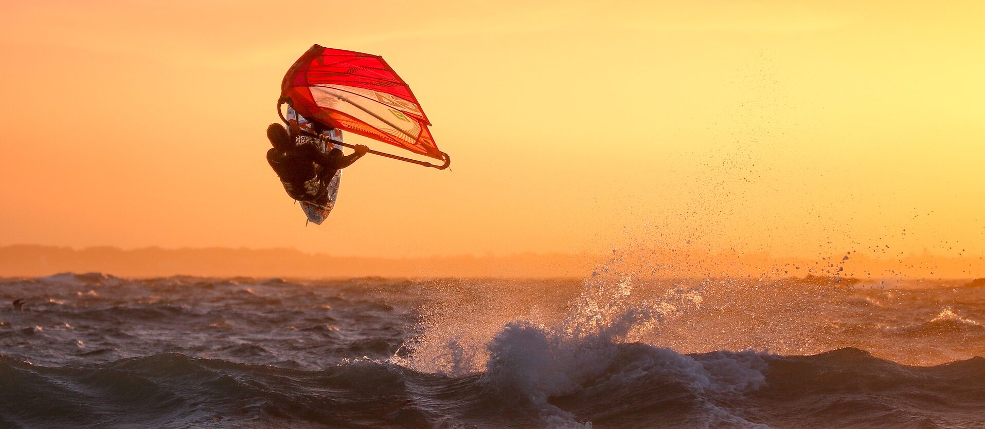 A windsurfer enjoy one of the best Hawaii activities on Oahu.
