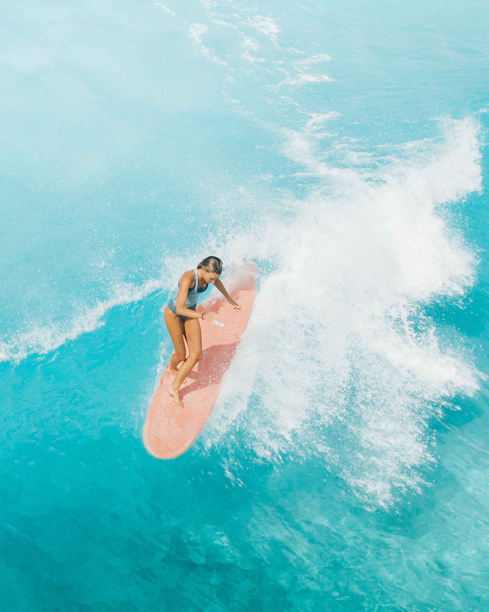 A woman surfing in Oahu